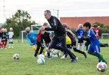 Træner i øvelse med spillerne Træner i øvelse med spillerne